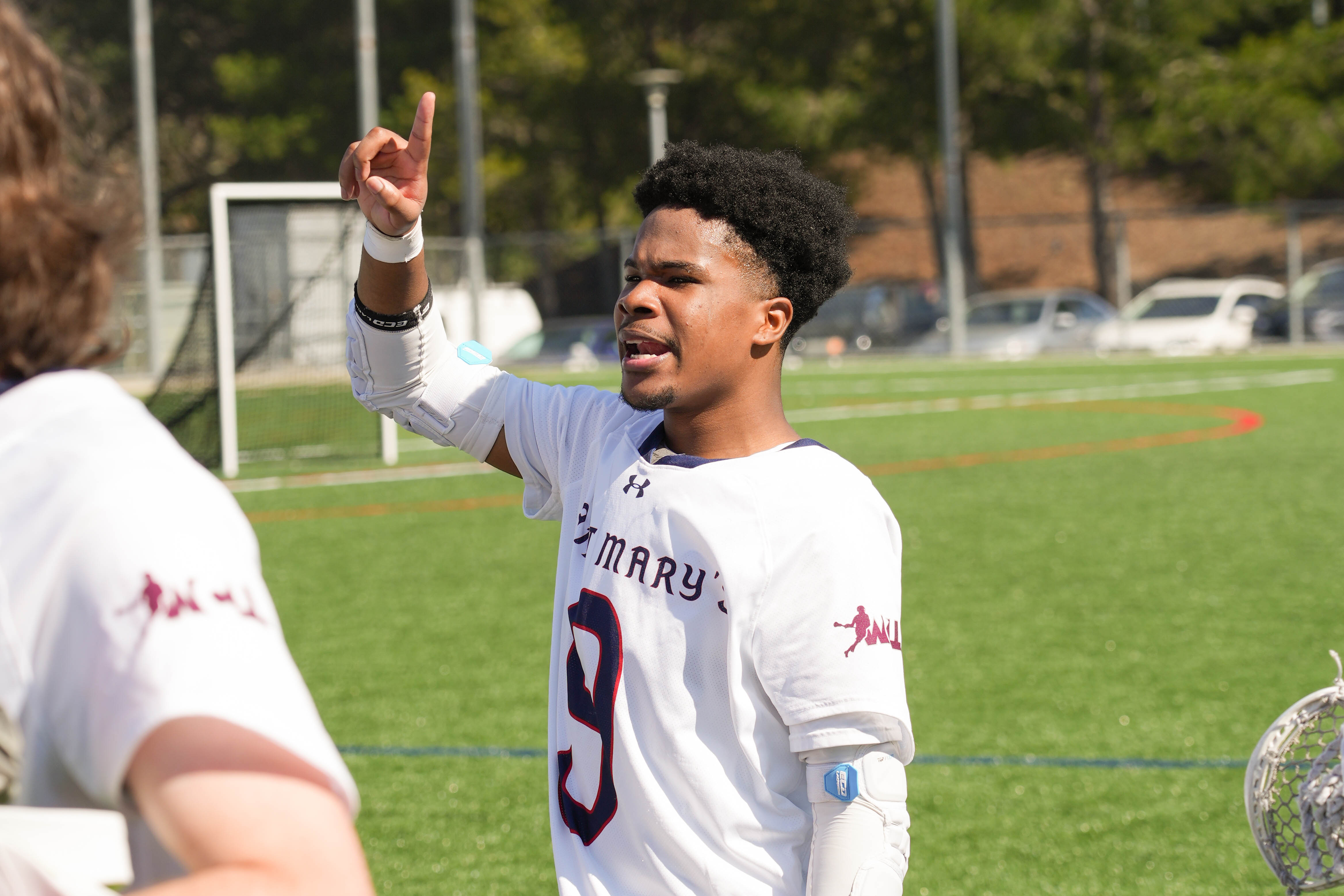 Speaking up:  #9 Jashae William ‘ 26 speaks up during the halftime gathering to encourage the team. / Photo by Dominico Russo ‘24