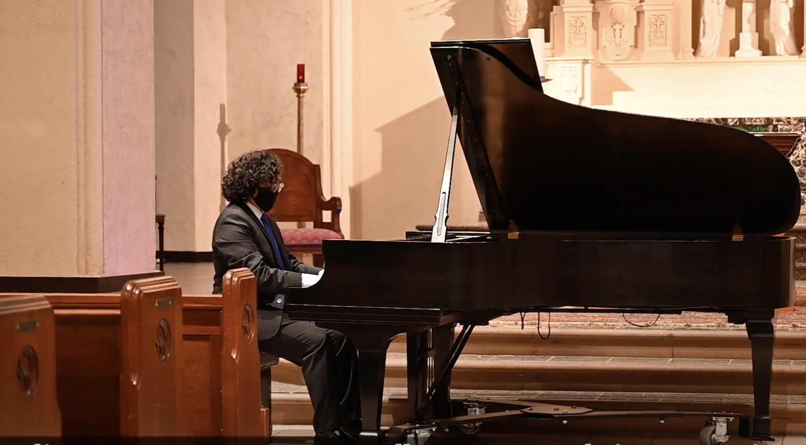 Aria Querubin playing piano in recital