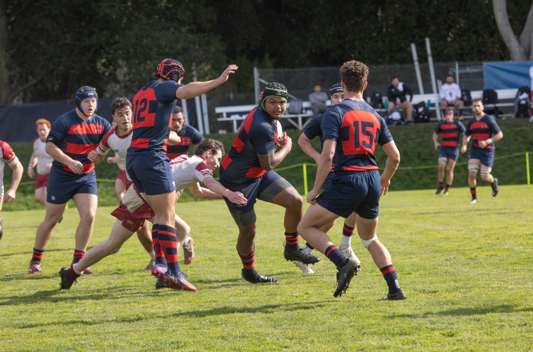 Breaking Through: King Matu ‘24 dodges the defender while carrying the ball up the field. /Photo By Rebecca Harper