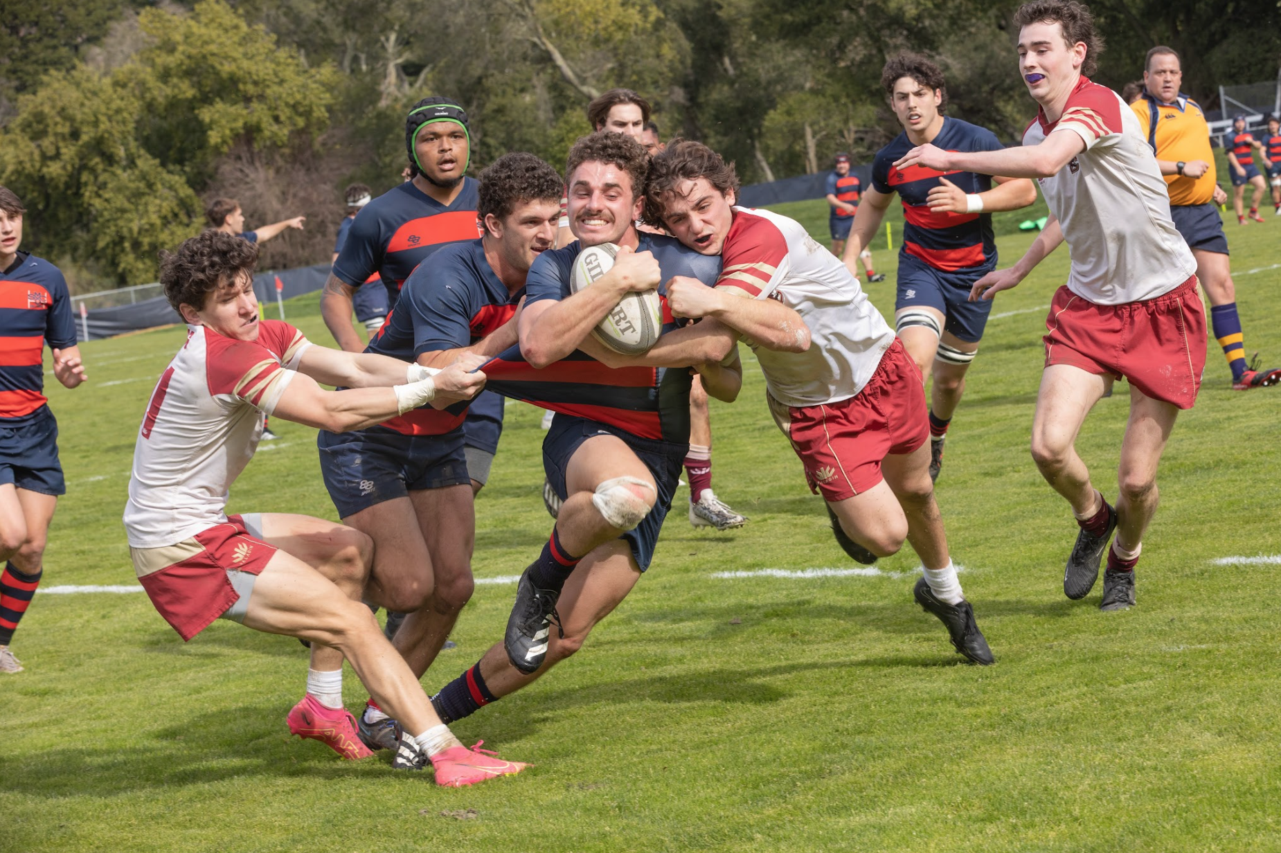 Mario Storti ‘26 is pushed into the try zone by Erich Storti MA’24 in an attempt to increase the lead against Boston College.