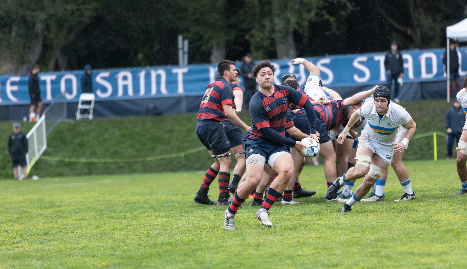 Ethan Taufa looks to pass the rugby ball 