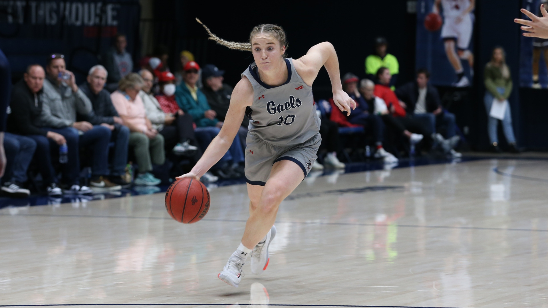 Women's basketball player Tayla Dalton drives with the ball