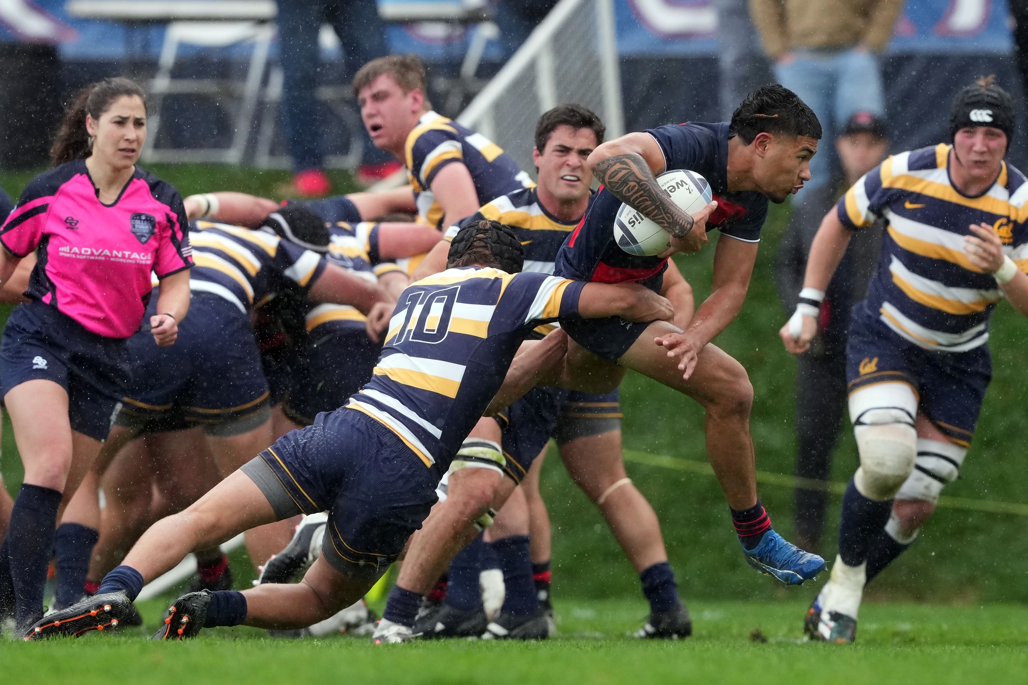 Missed Tackle: Cal defender is unable to pull down Iosefa Toia'ivao’26 while he dashes to the try zone. / Photo Courtesy of Darren Yamashita, The Ultimate Sports Guide Magazine.