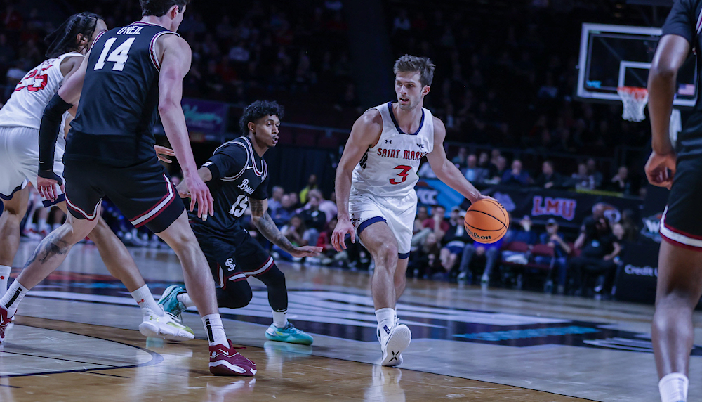 Men's basketball player Augustus Marciulionis drives against Santa Clara in WCC Semifinals, March 2024