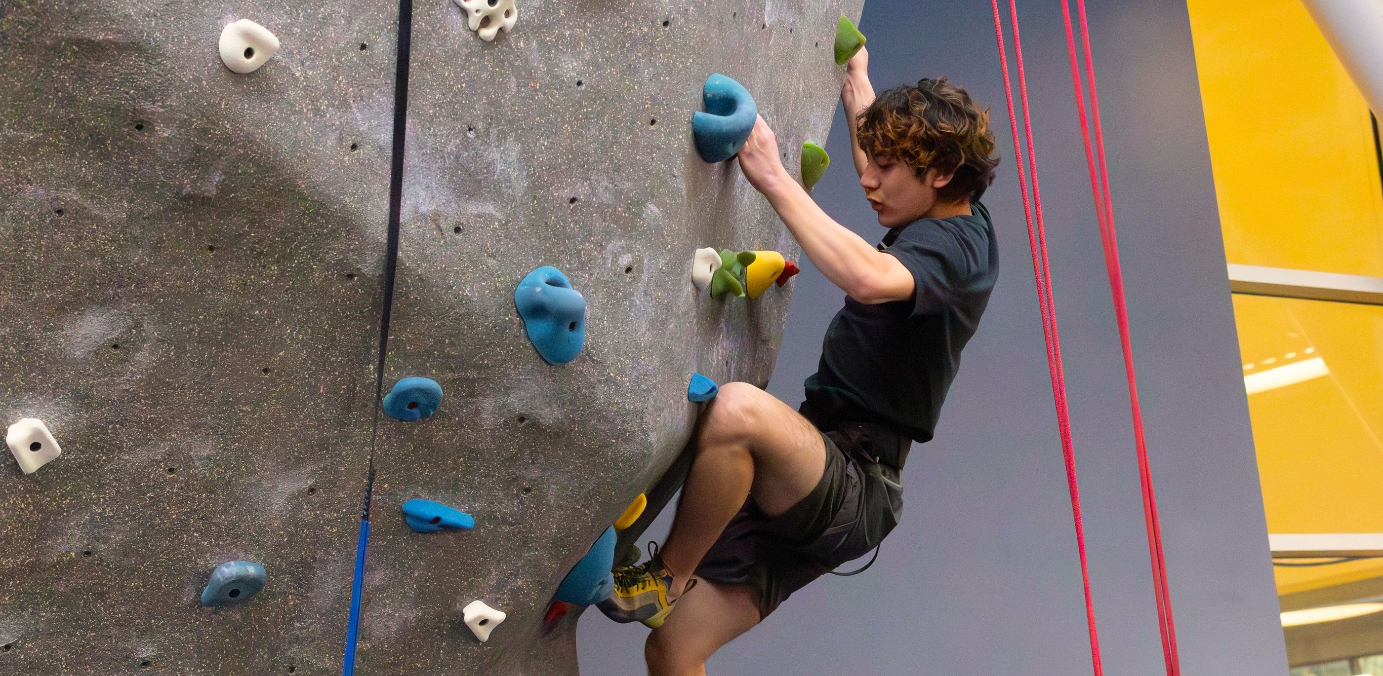 Student trying out the climbing wall