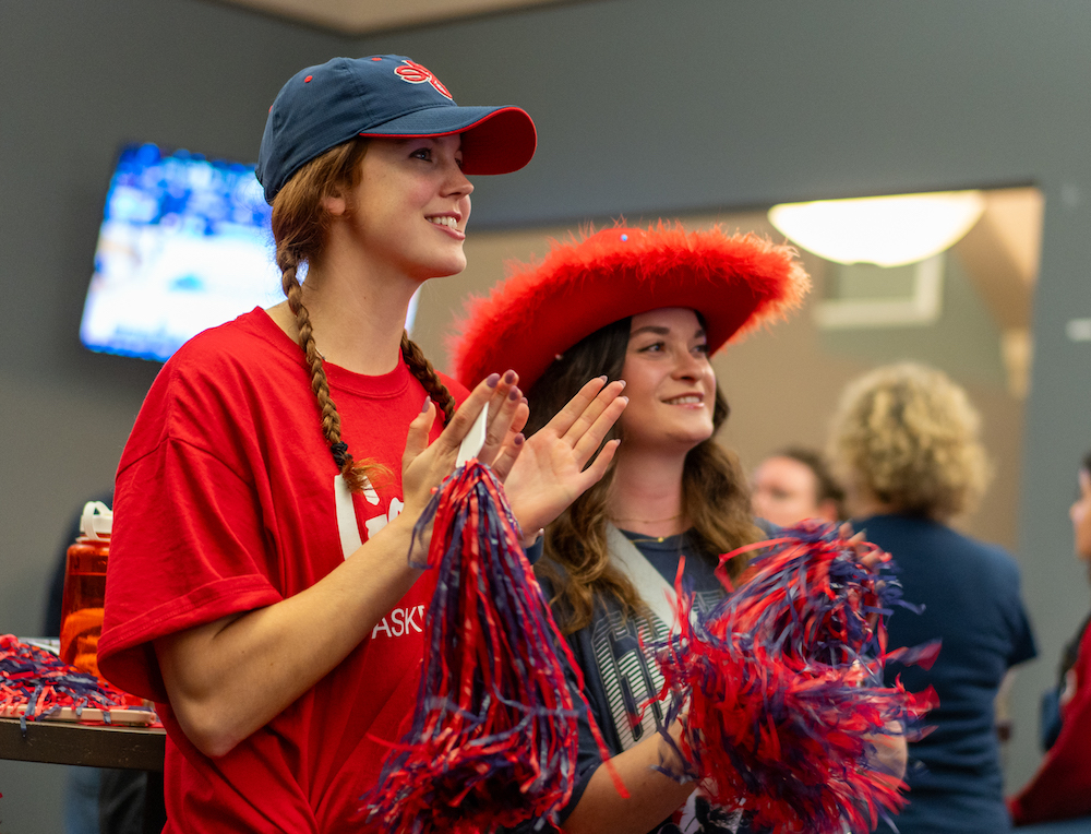 Two Saint Mary's students cheer for the Gaels in the 2024 NCAA Tournament