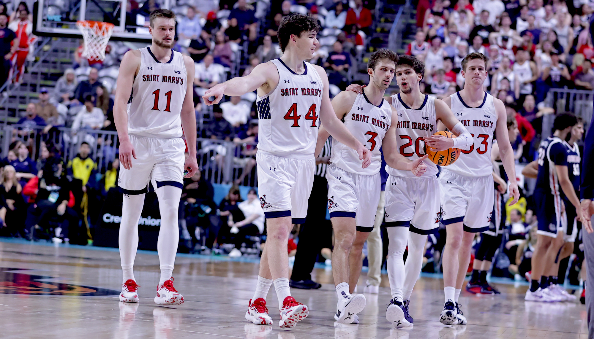 Five Saint Mary's men's basketball players on the court against Gonzaga in WCC Tournament Championship