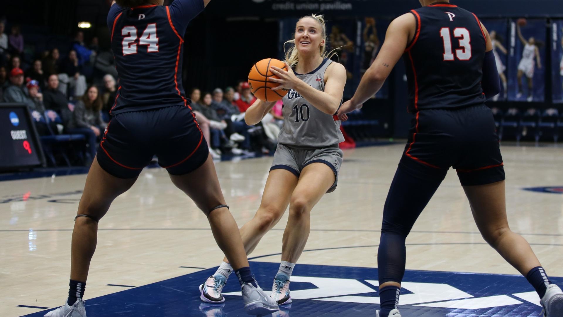 Women's basketball player Tayla Dalton prepares for a jump shot against Pepperdine in February 2024