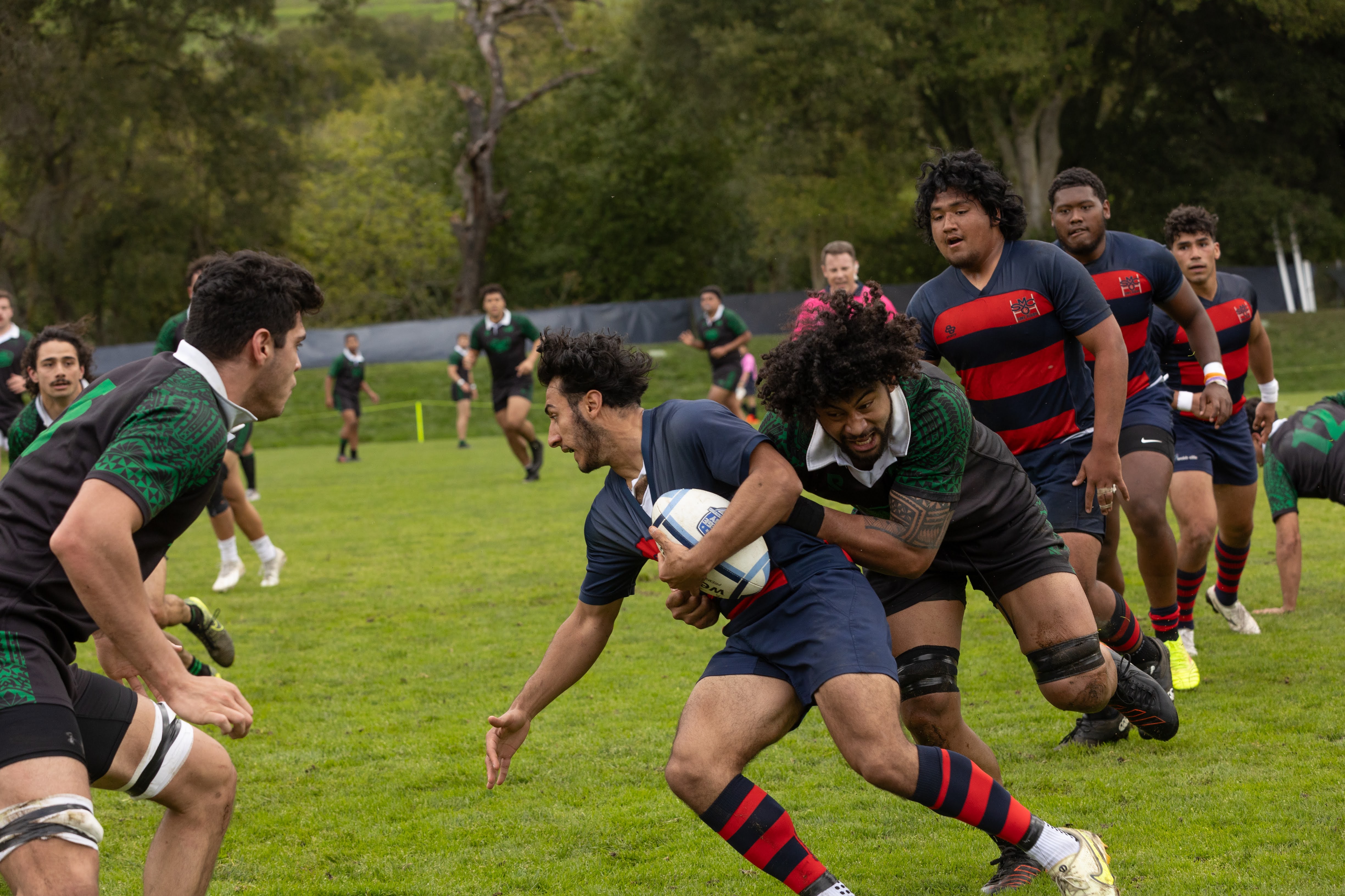 Isaak Quqish dodges the defender, Men's Rugby