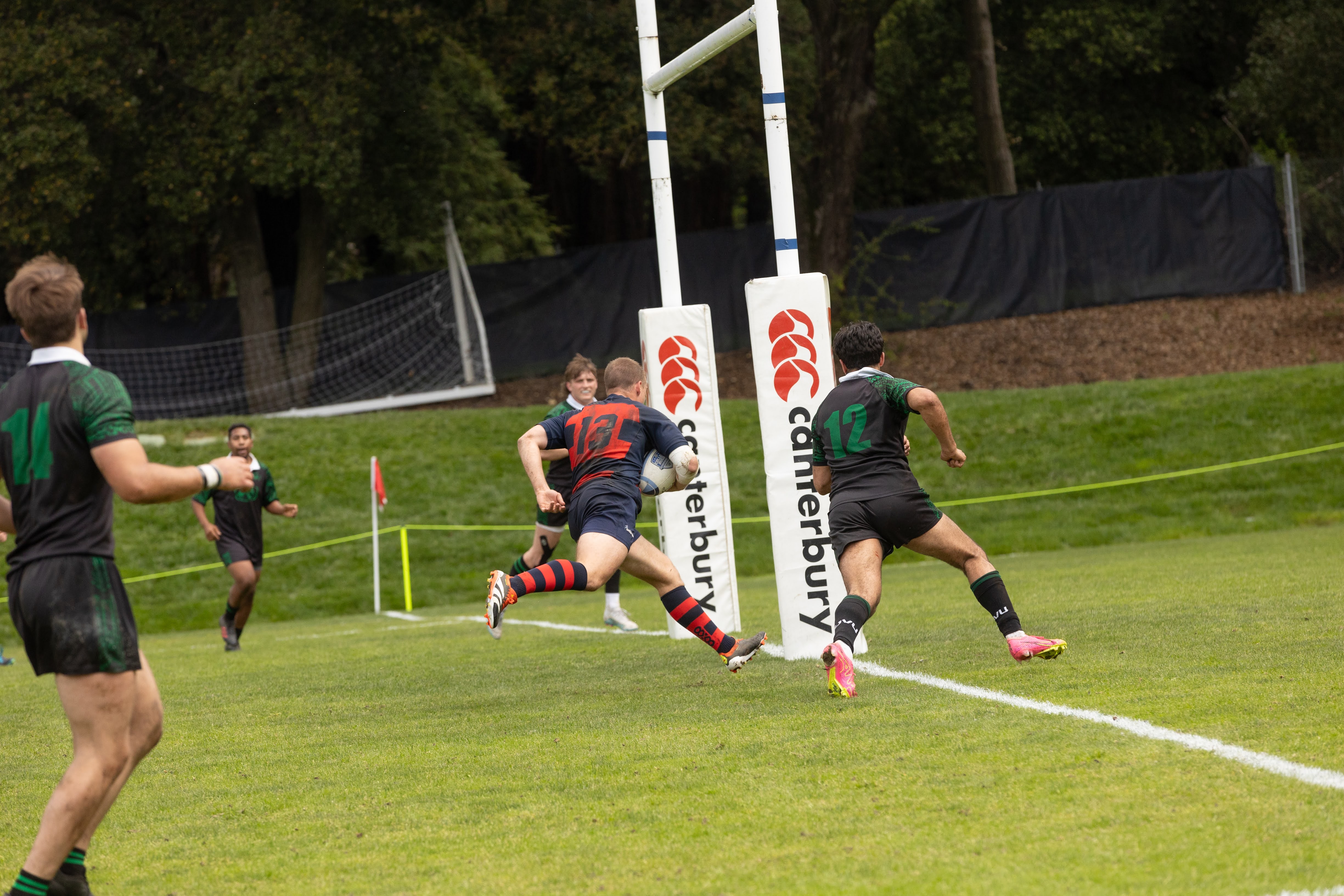 Will Larouge runs into the try zone for Men's Rugby game
