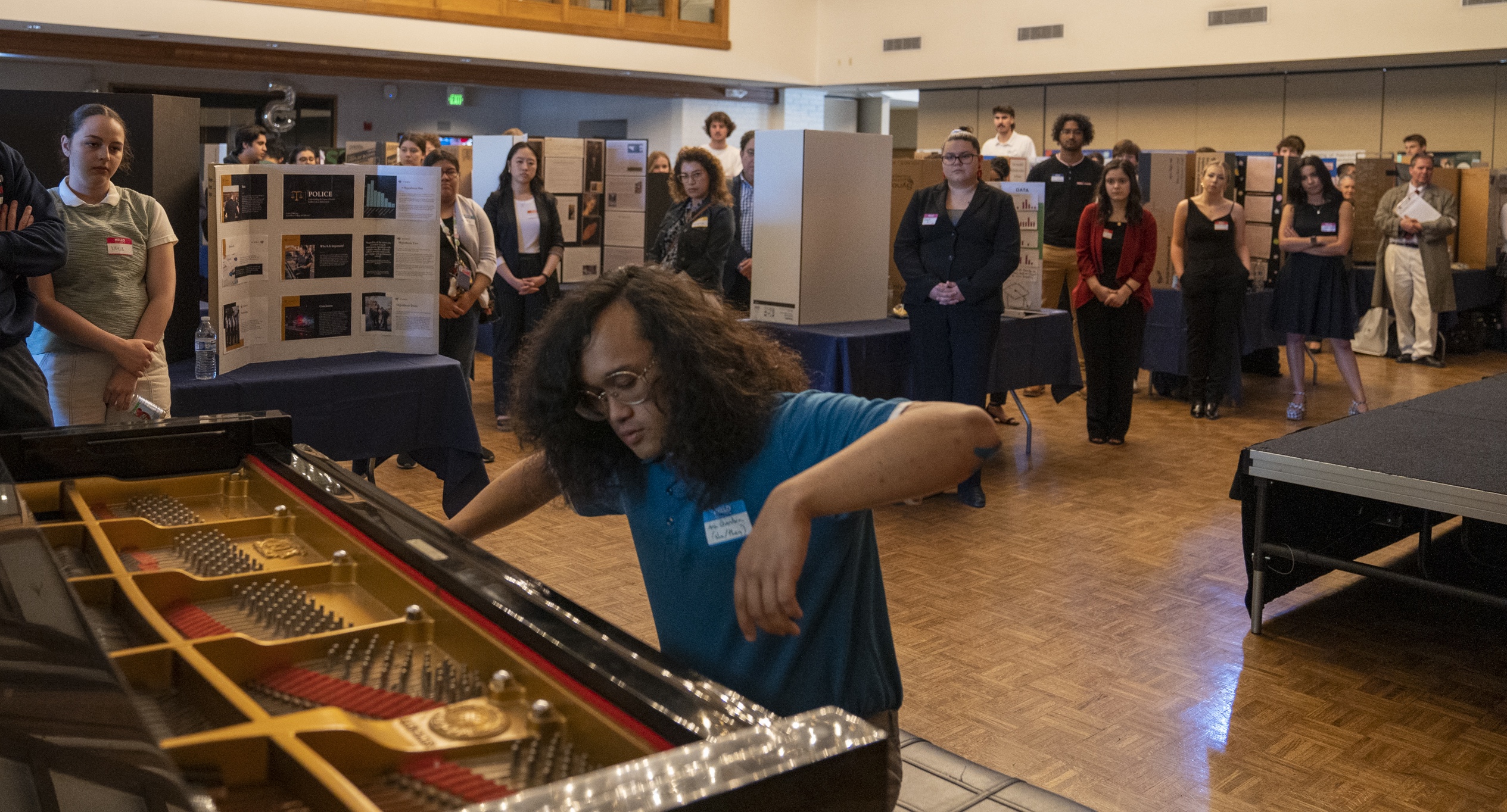 Aria Querubin '24 playing piano at 2023 SMC Student Research and Creative Works Conference