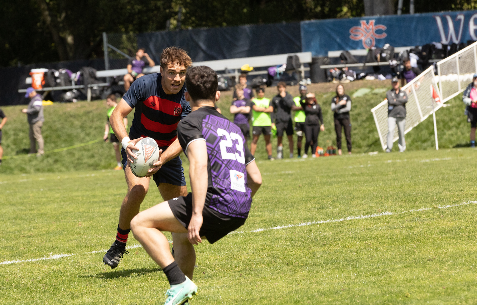 Ethan Younger carries the rugby ball 