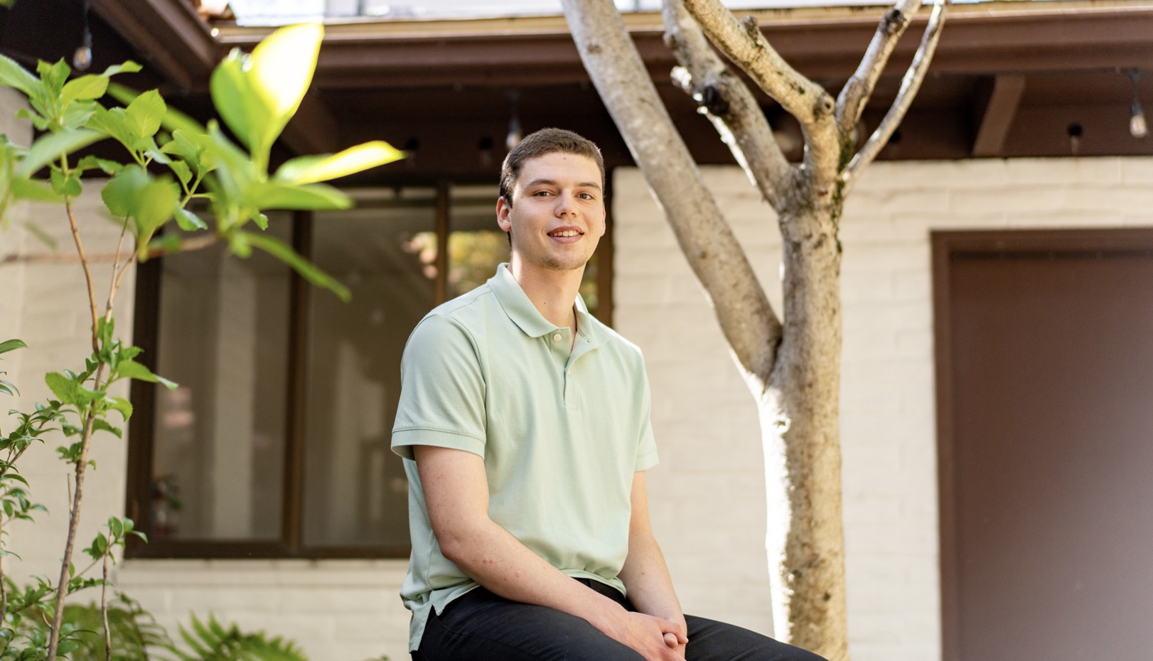 Andrew Aroutynov '24 posed outside SEBA building