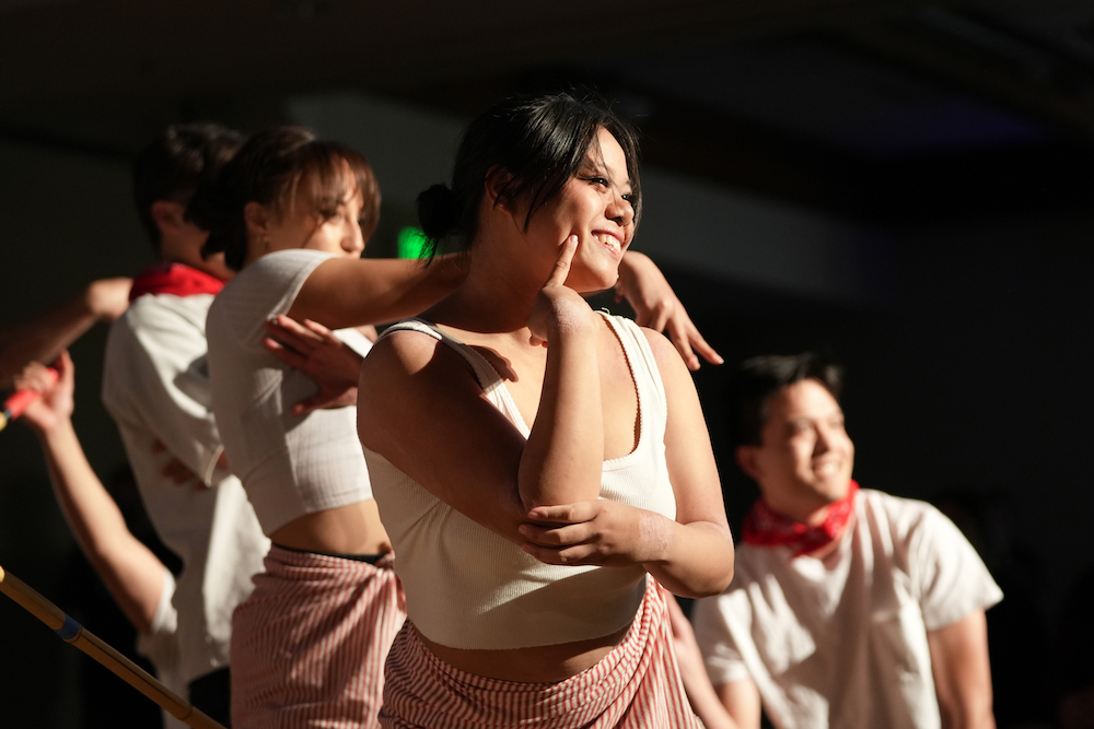 Students dance Tinikling, a traditional dance in the Philippines, at 2024 Cultural Showcase