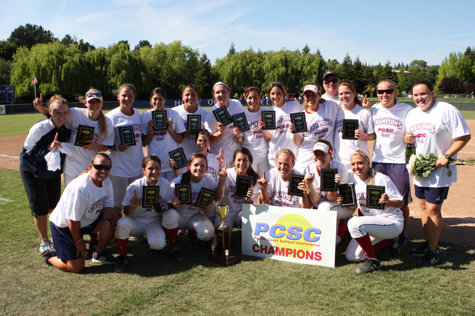 The 2010 softball players with PCSC Championship trophies
