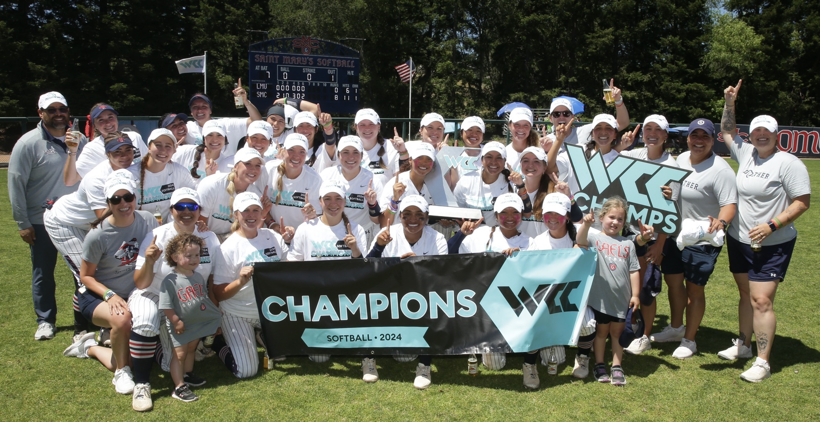 Saint Mary's softball team holding up the West Coast Conference Champions banner