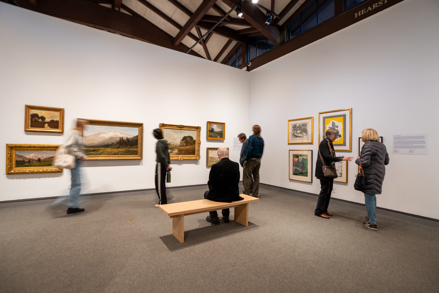 students and visitors view art gallery