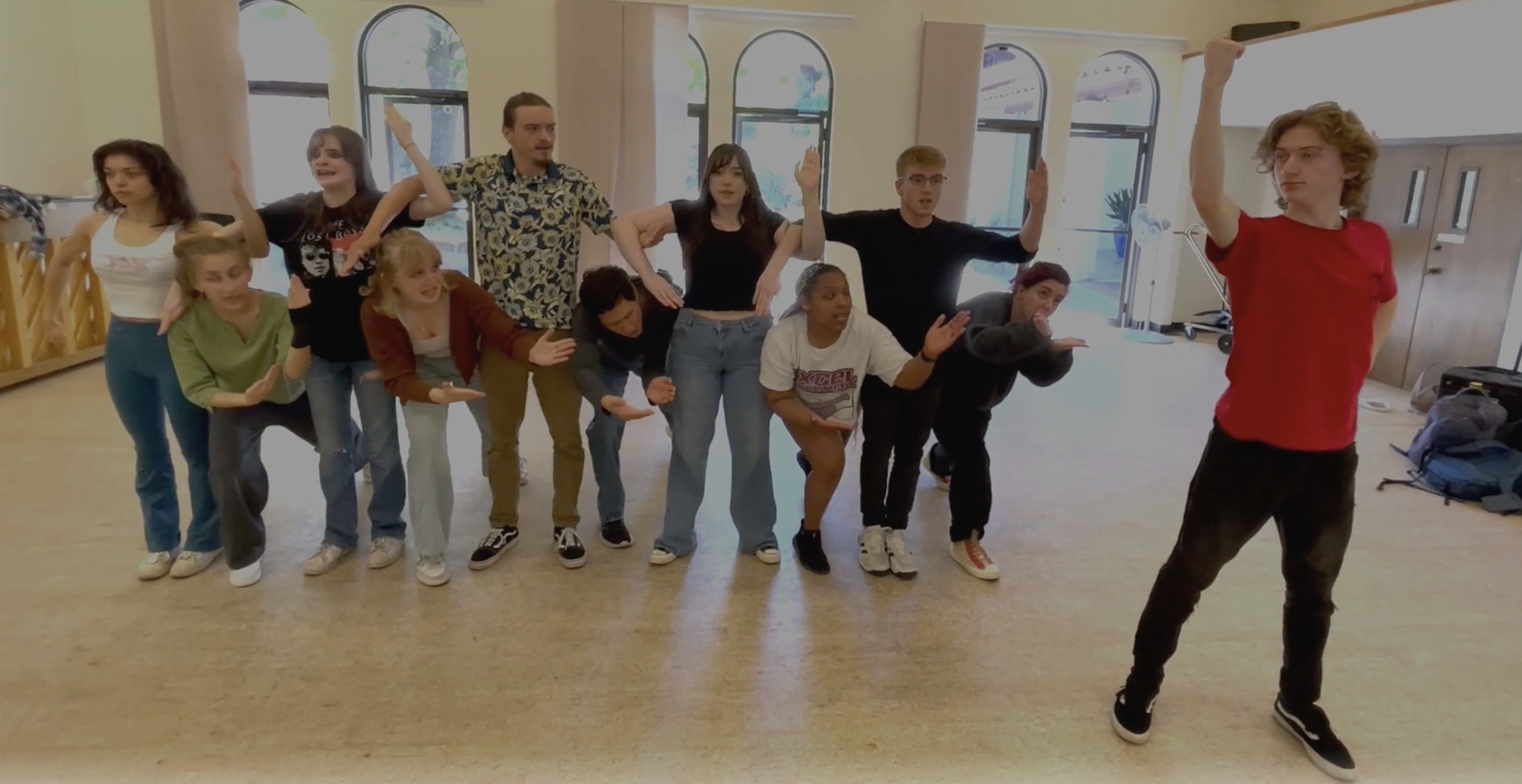 Acting 3 class arms entwined performing The Greek Chorus in the Acting studio.