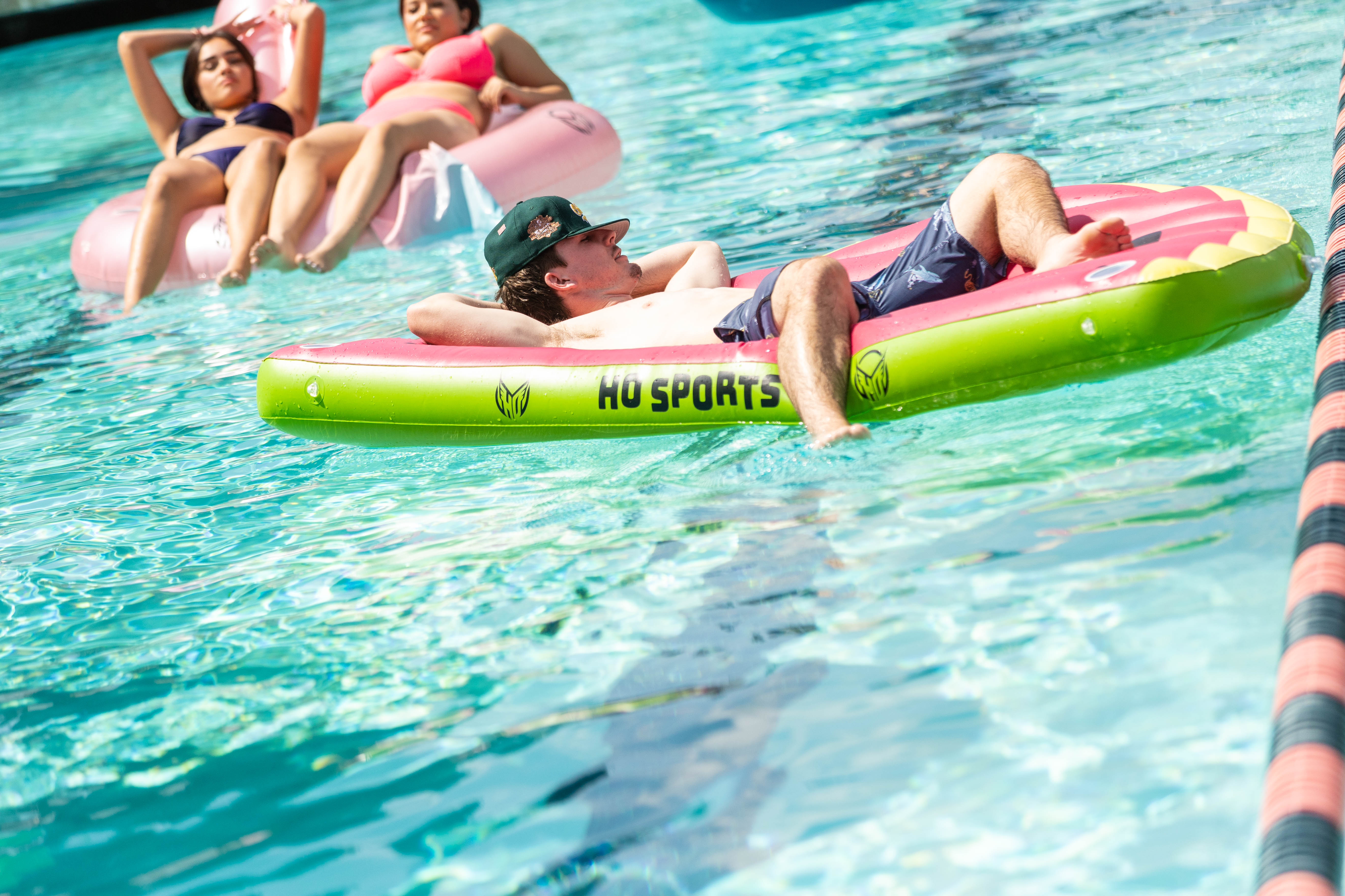Floating By: Blake Conrad ‘28 reclines on the pool float while sunbathing at the Weekend of Welcome Pool Party. / Photo by Rebecca Harper