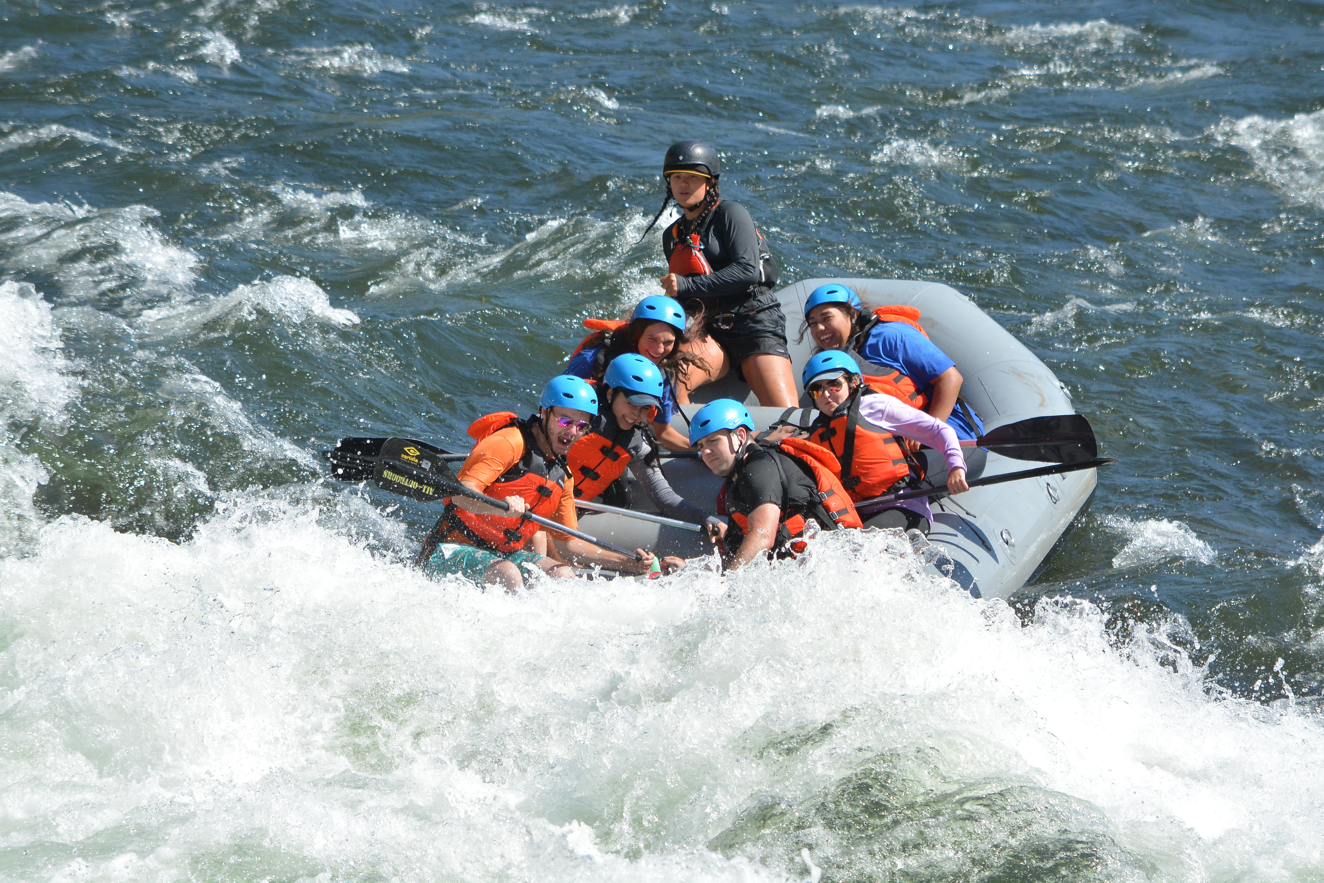 Brace Yourself: Participants lean into the raft to brace for the Class III rapid known as Hospital Bar on the South Fork of the American River. / Photo courtesy of Hotshot Images