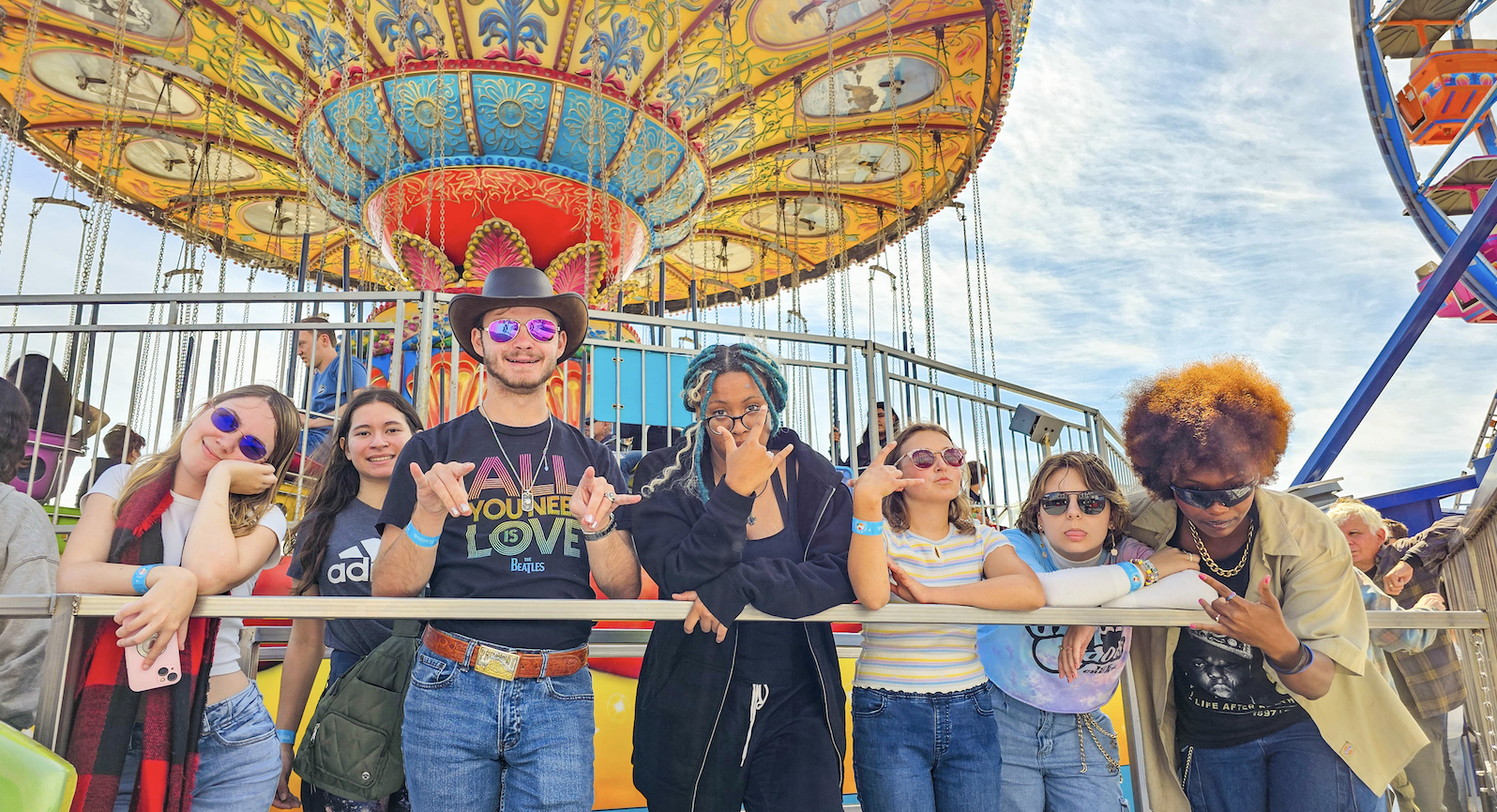 Far Out: Gael beach goers pose for a quick photo while waiting in line to ride the Sea Swings at the Santa Cruz Beach Boardwalk on Sunday, Sept 15. / Photo Courtesy of Hector Garcia ‘28