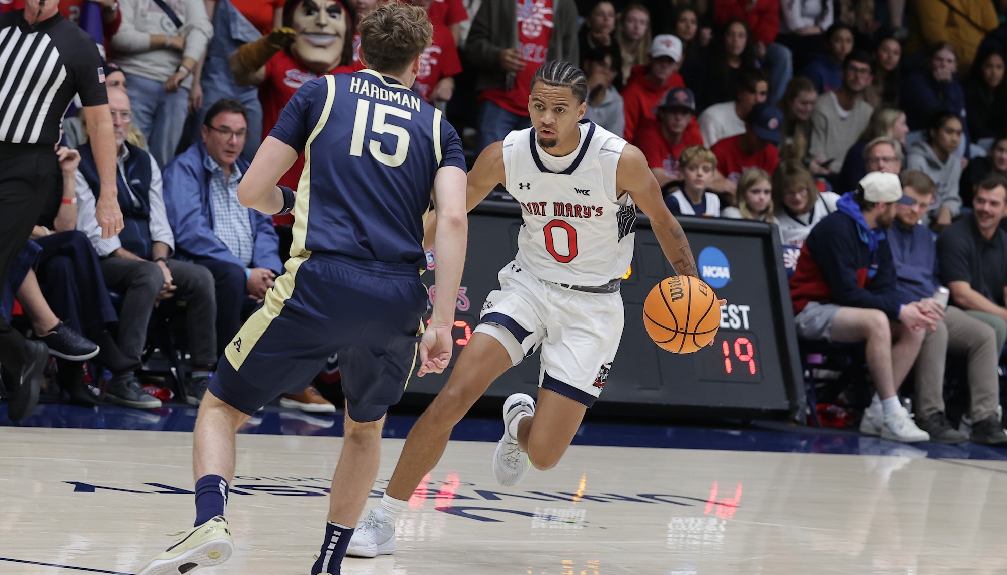 Men's Basketball Player Mikey Lewis drives against Akron on November 12, 2024