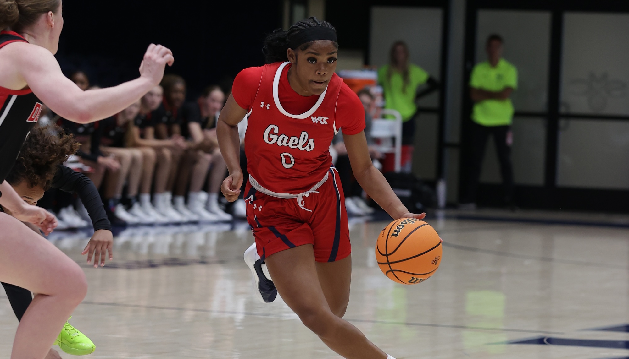 Women's Basketball player Jada Hunter drives against University of Denver in November 2024