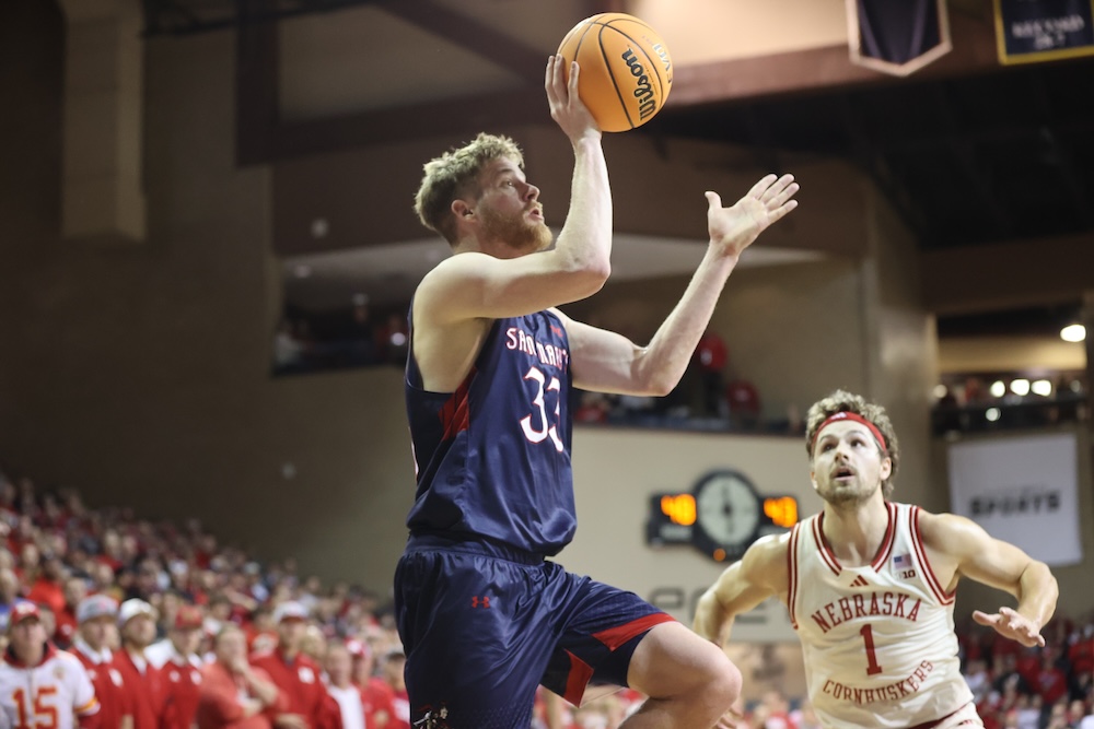 Men's Basketball player Luke Barrett shoots against Nebraska on Nov. 17, 2024