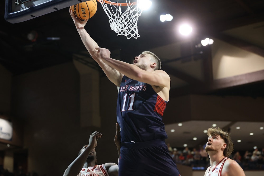 Men's Basketball player Mitchell Saxen shoots against Nebraska on Nov. 17, 2024
