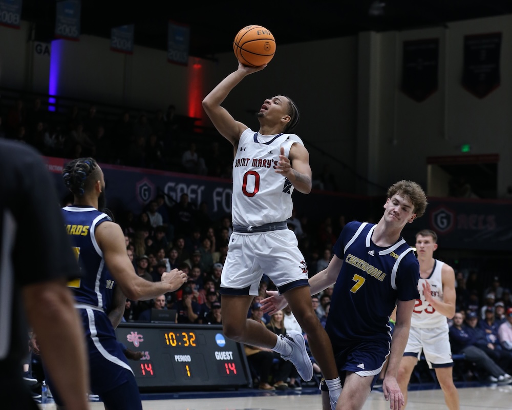 Men's Basketball player Mikey Lewis shoots against Chattanooga in November 2024