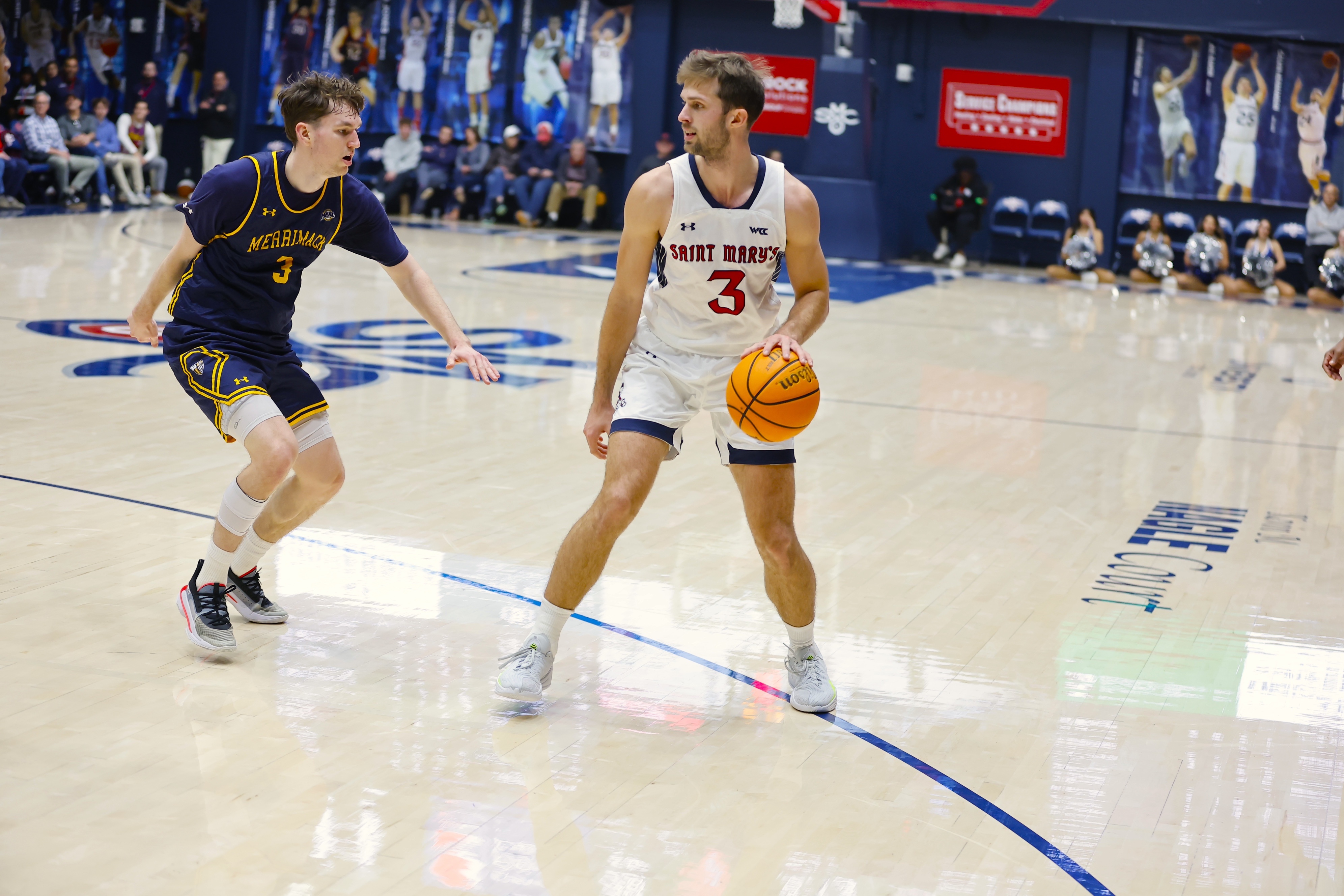 Augustas Marciulionis goes up against a Merrimack player