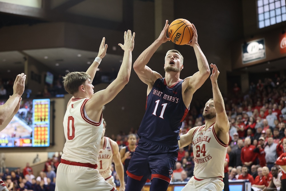 Men's Basketball player Mitchell Saxen shoots against Nebraska in Nov. 2024