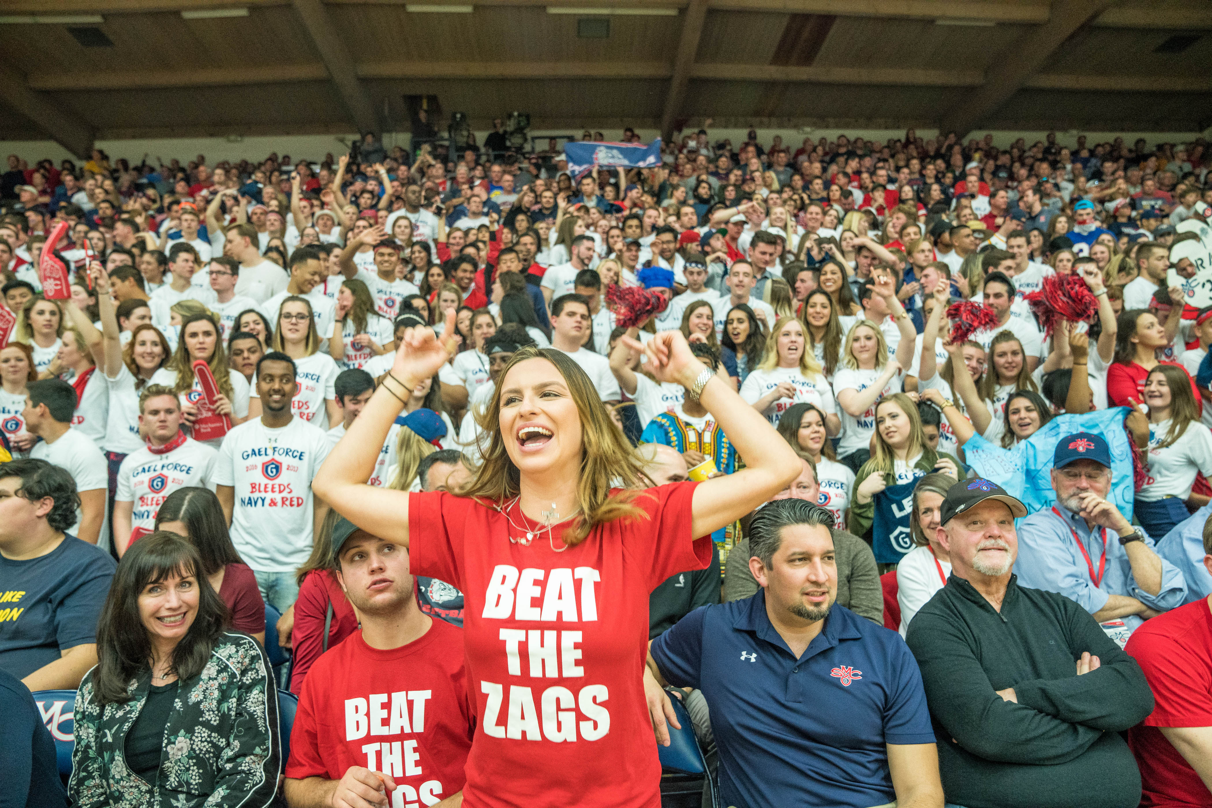 A fan wearing a &quot;Beat the Zags&quot; cheers in front of a sold out gym
