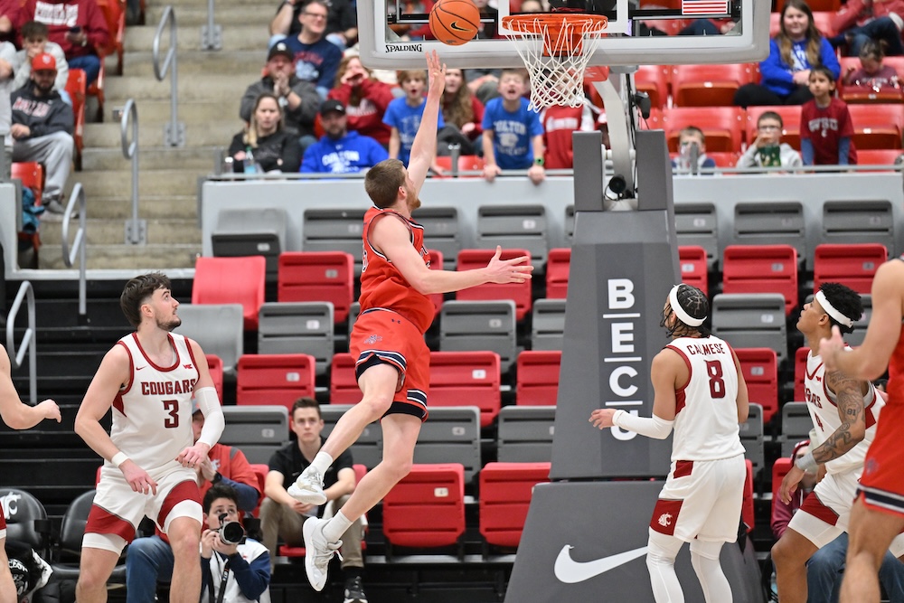 Men's basketball player Luke Barrett shoots against WSU in January 2025