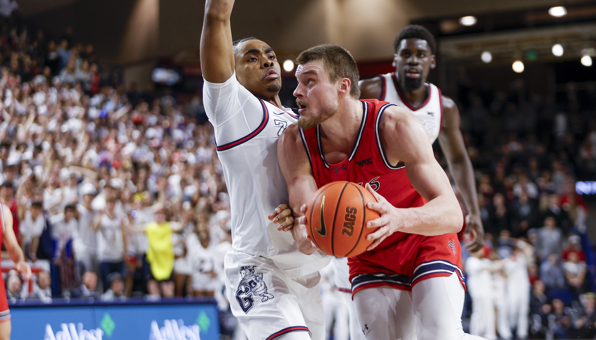 Men's basketball player Mitchell Saxen drives against Gonzaga in February 2025