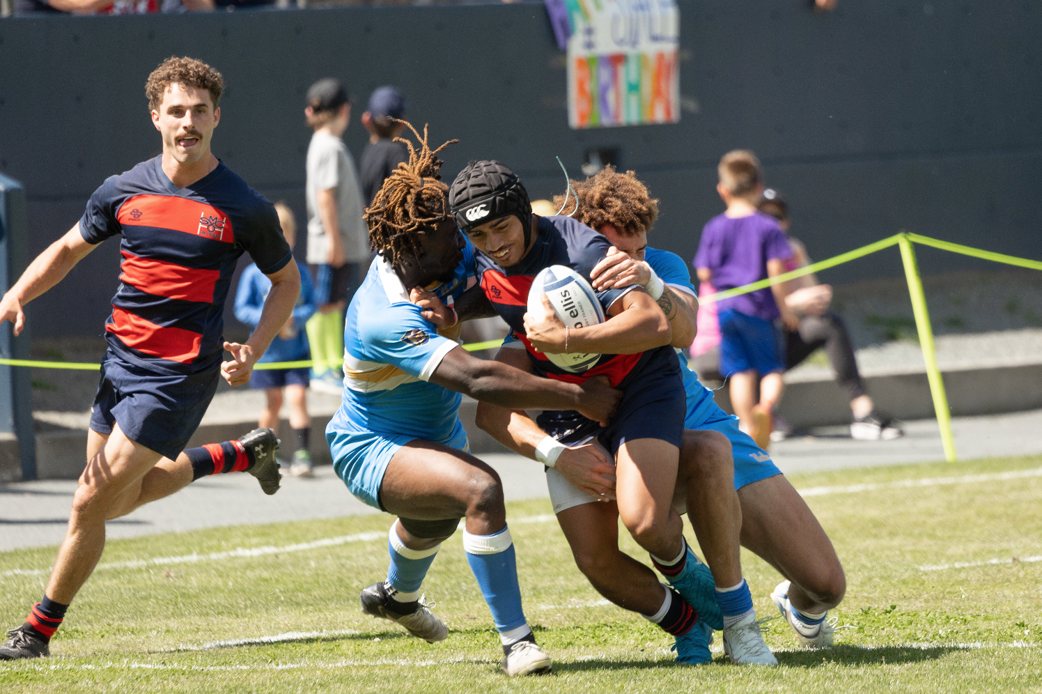 Siale Ofa pushed the defencers off him while moving the rugby ball forward