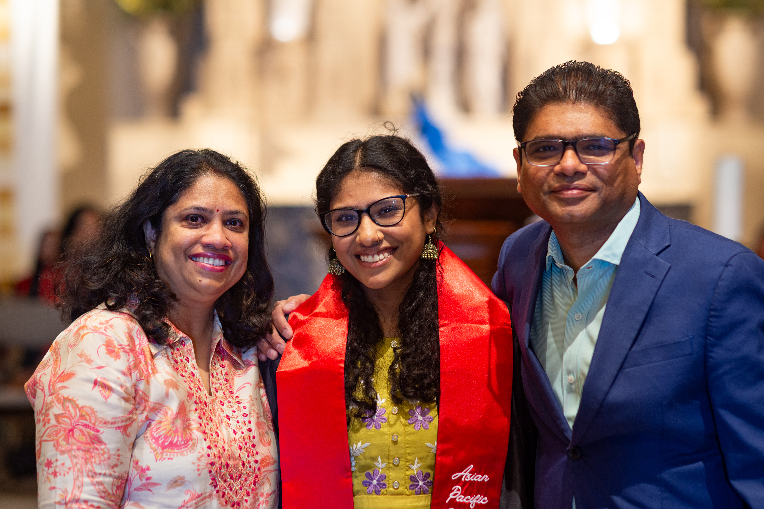 Students and parents posing at Asian Pacific Islander Graduate Celebration