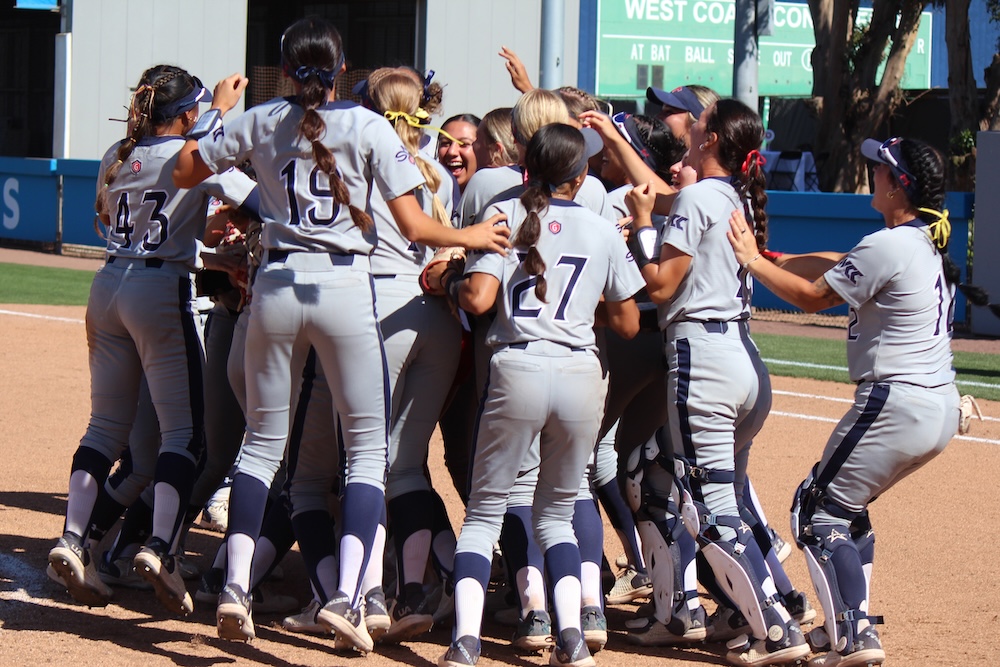 SMC Softball Team cheers in a huddle after winning WCC Title in May 2025