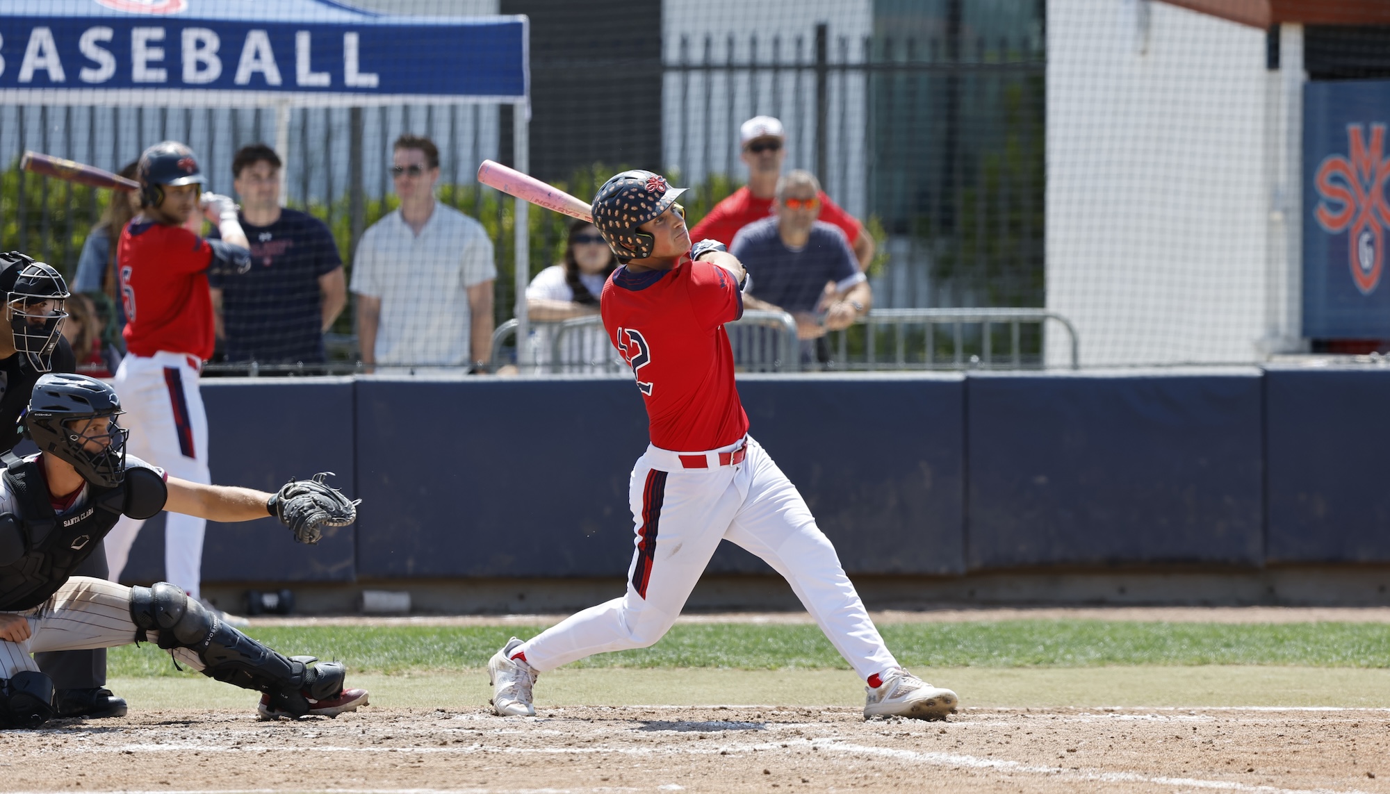 SMC baseball player hits at the plate