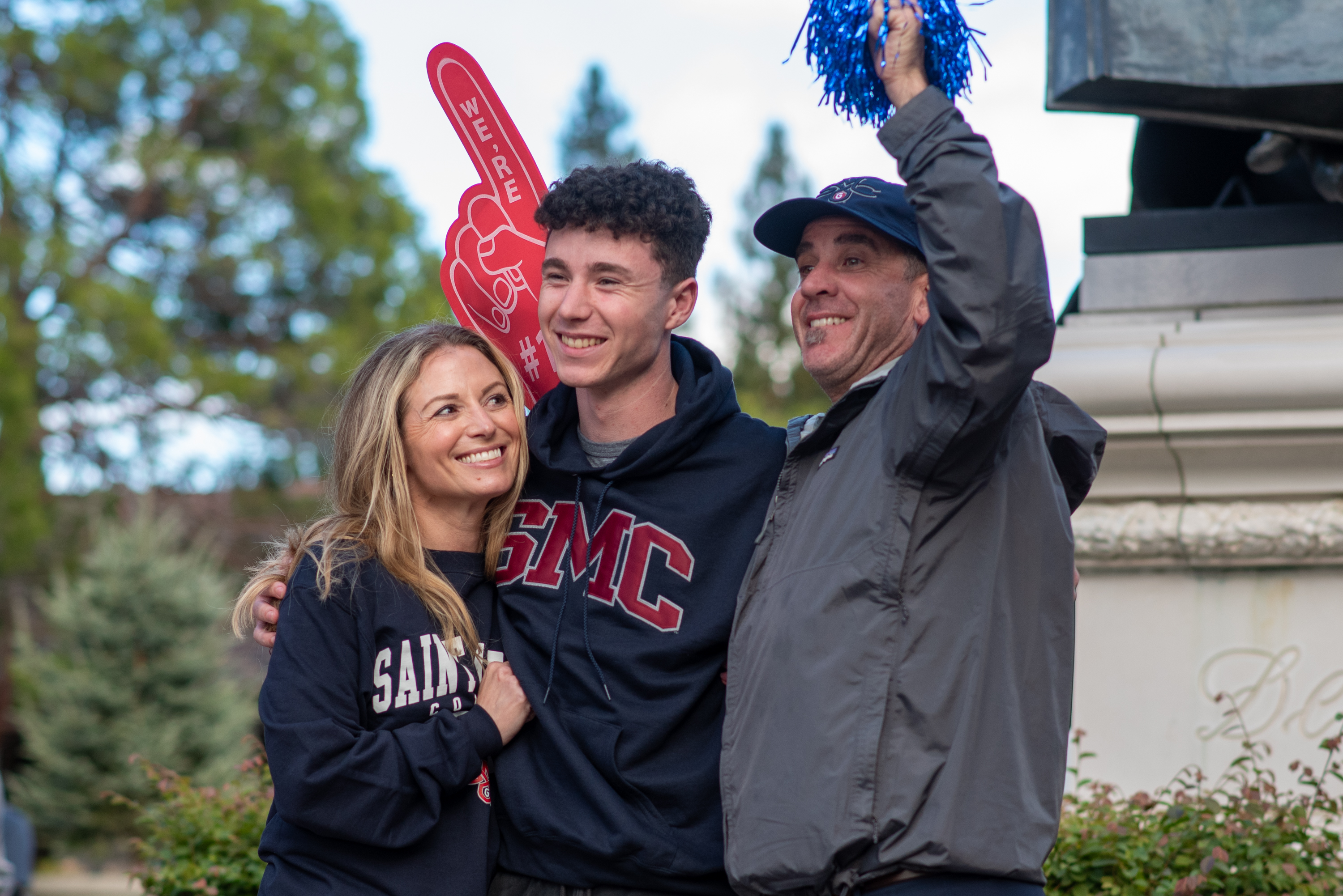 Picture of a student and his 2 parents