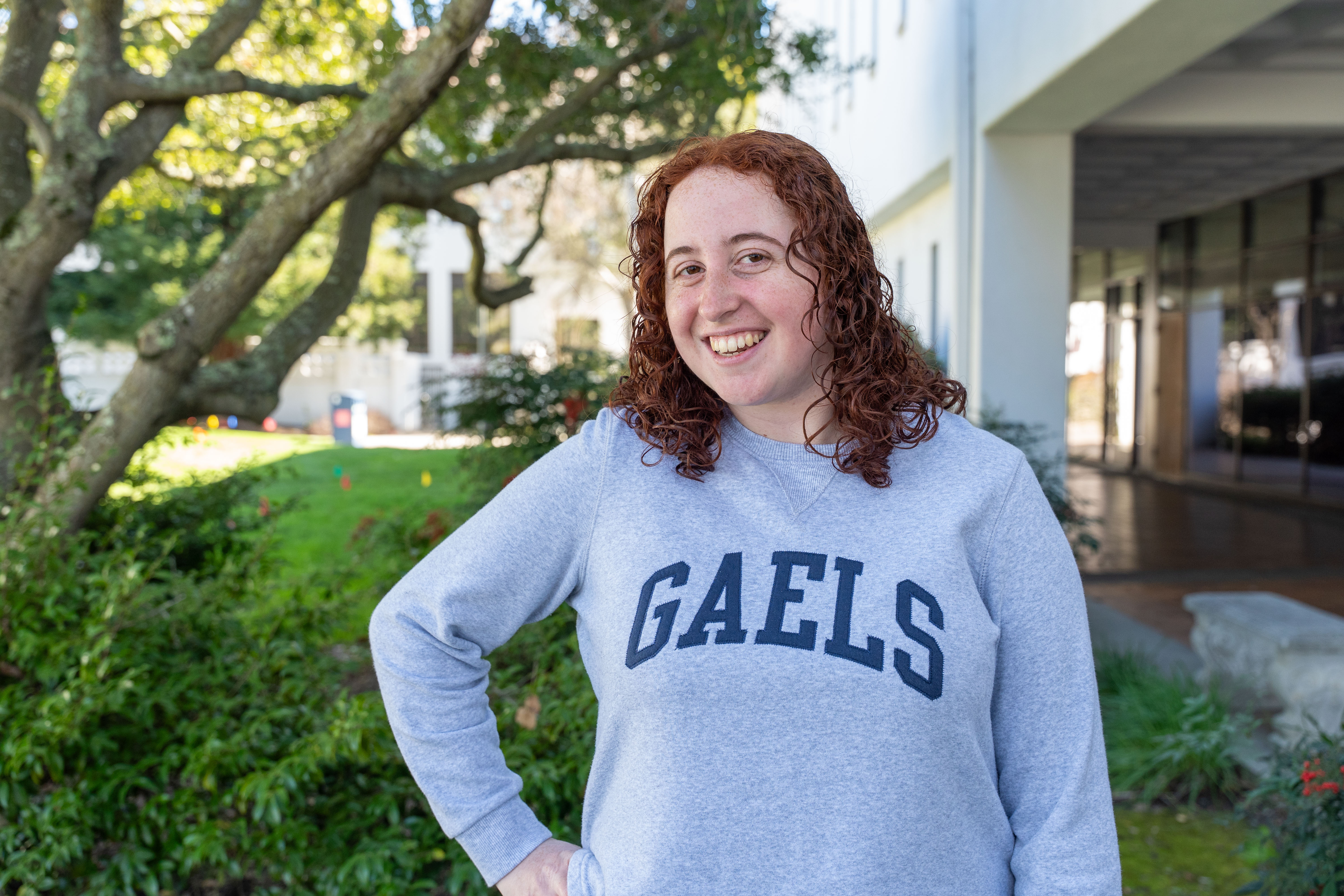 Carolyn Gersten smiles in front the of the library