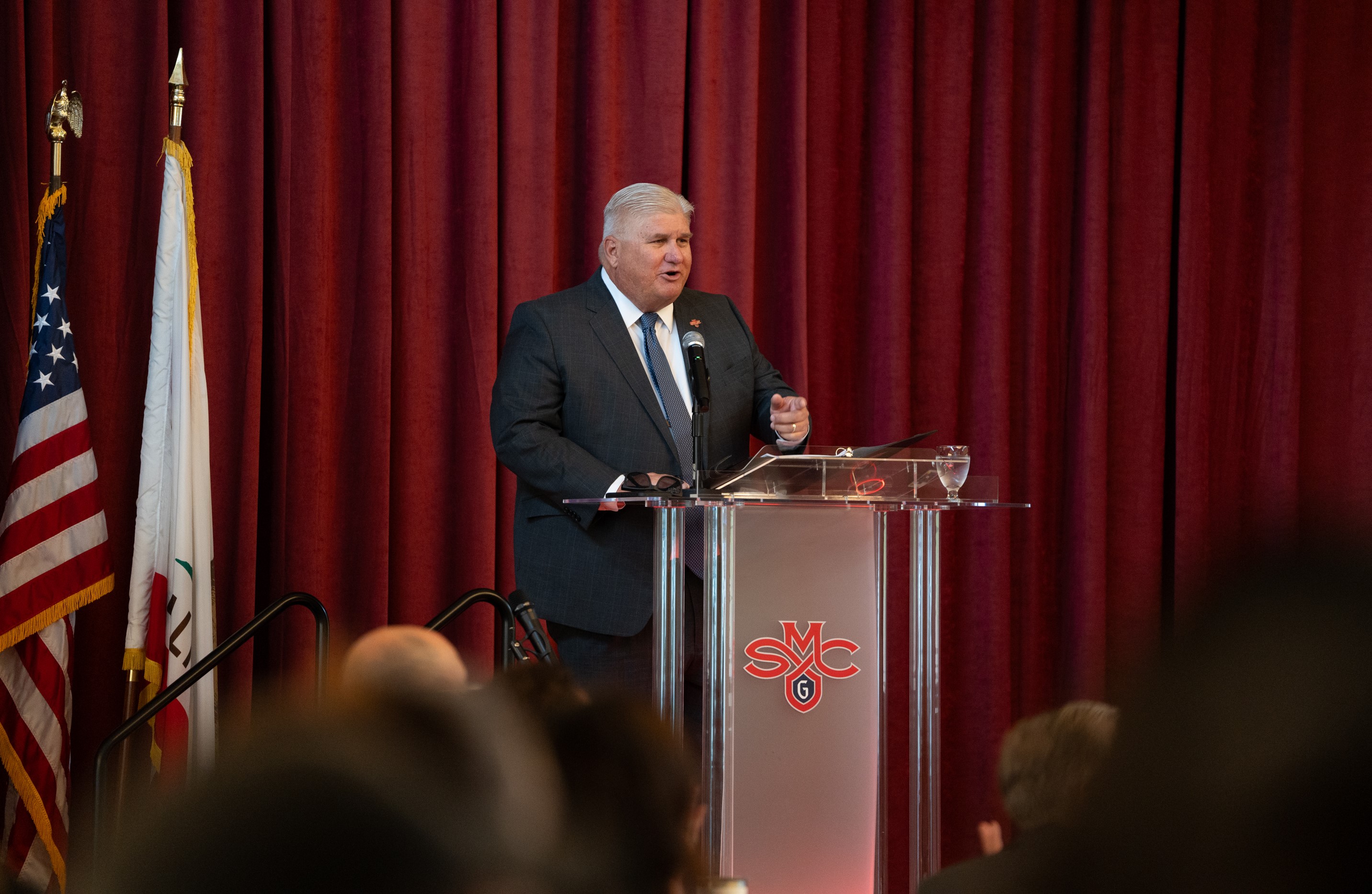 Roger at State of the College podium