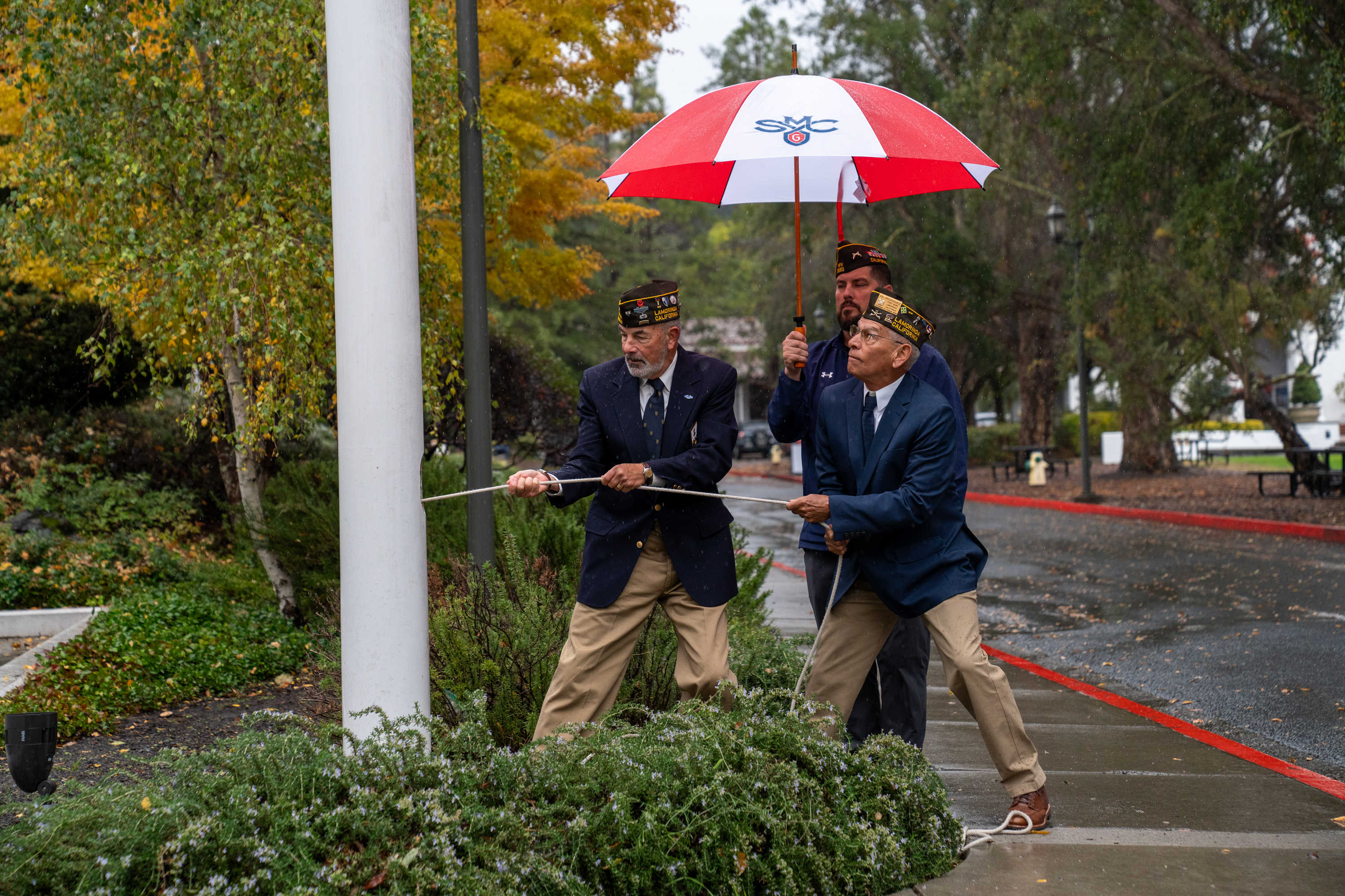 Veterans raising the flag at the 2024 Veterans Day Flag Raising Ceremony at SMC