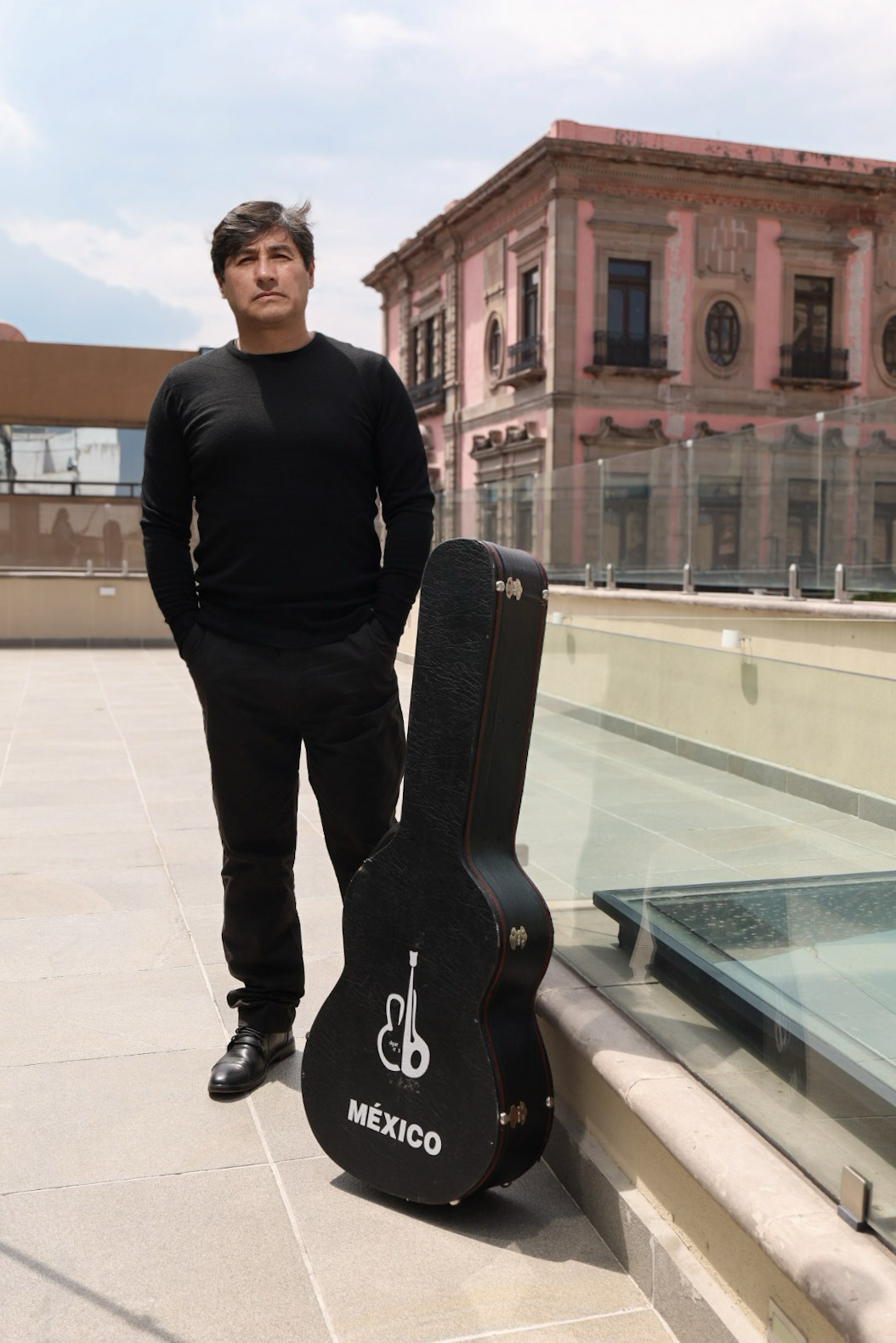 Solog guitarist Edgar Ramírez stands next to his guitar in Mexico City.
