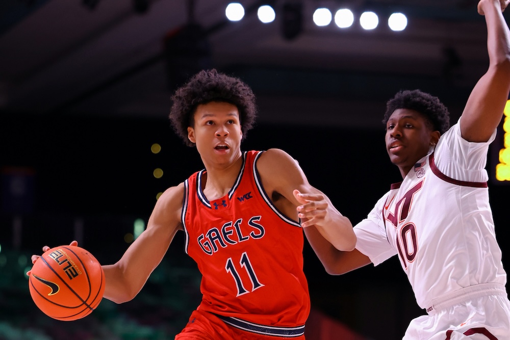 Basketball player Dillan Shaw drives against Virginia Tech in November 2025