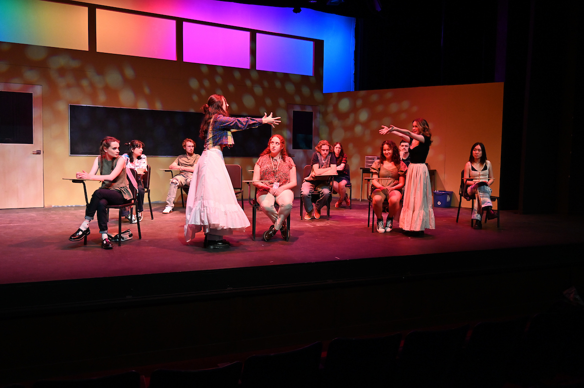 two female friends reach out to each other in a dance on the JOHN PROCTOR IS THE VILLAIN set