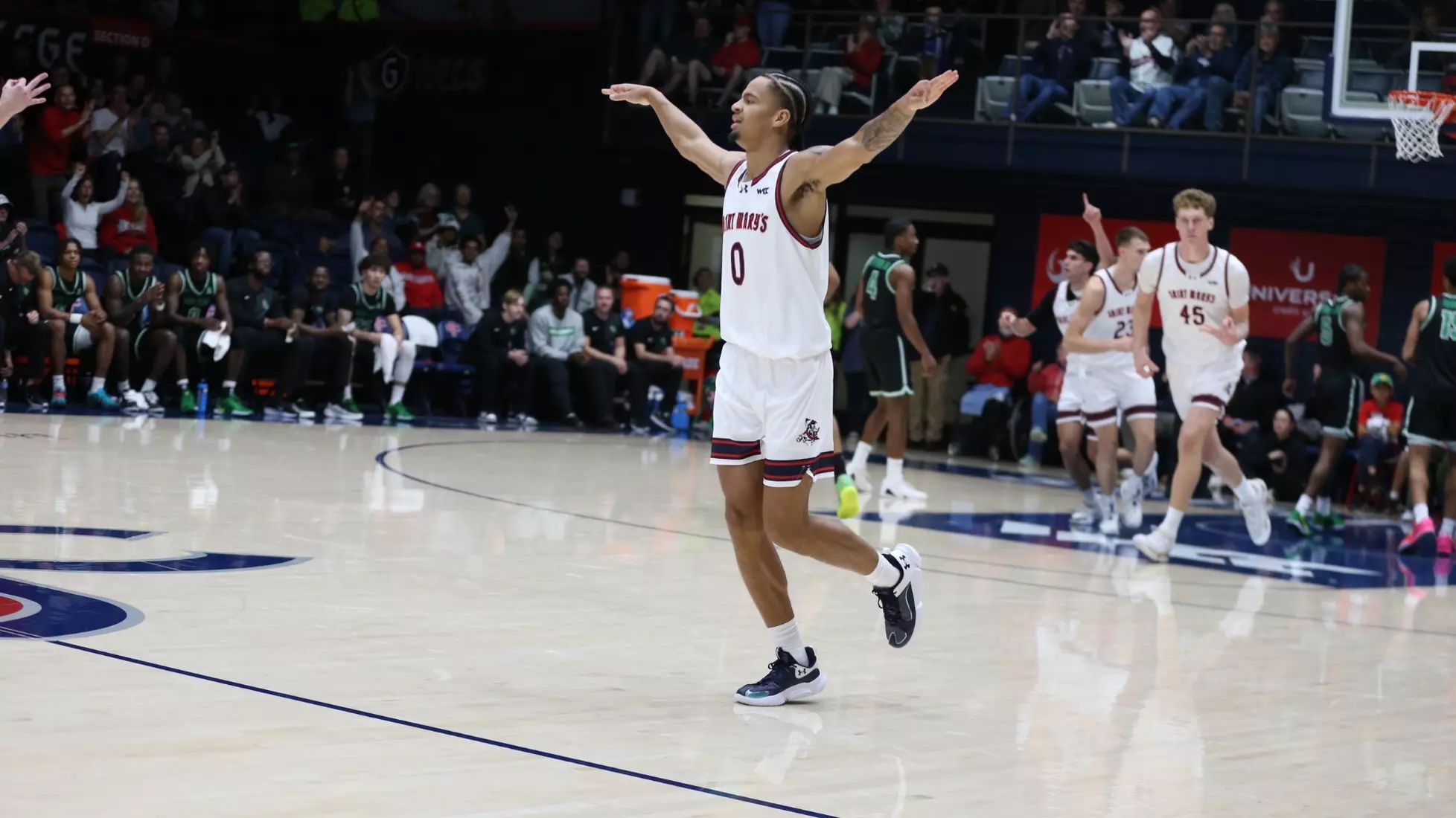 Men's Basketball player Mikey Lewis celebrates while the Gaels play North Texas in November 2025