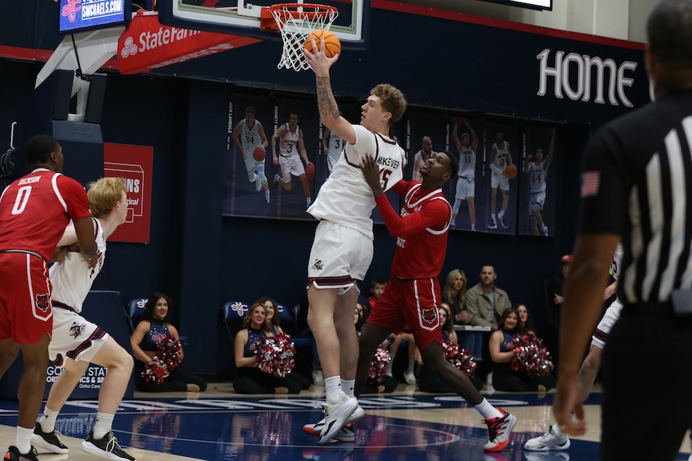 Basketball player Andrew McKeever shoots against Arkansas State in November 2025
