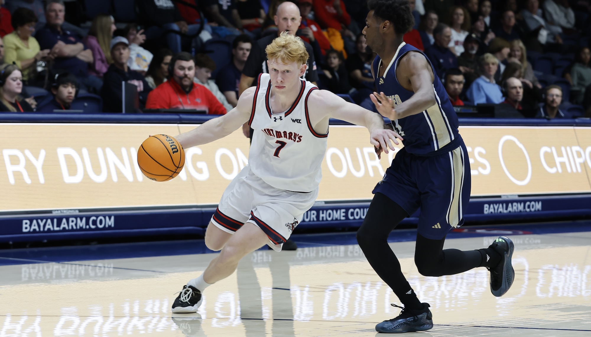 Men's basketball player Joshua Dent drives against UC Merced in November 2025
