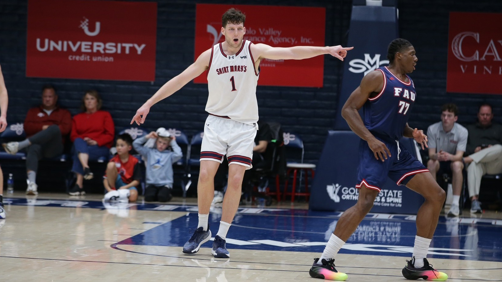 Basketball player Harry Wessels points while Gaels play Florida Atlantic in December 2025
